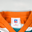 Maglietta vintage con grafica dei Miami Dolphins della NFL, verde acqua e arancione | Abbigliamento per tifosi anni 2000