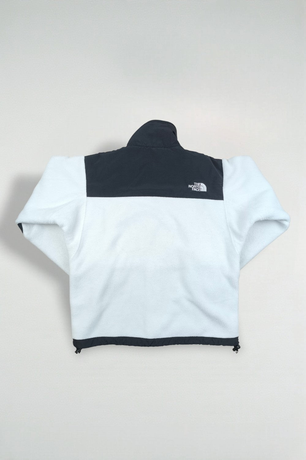 Giacca in pile vintage The North Face da donna, nera e bianca | Abbigliamento outdoor anni 2000